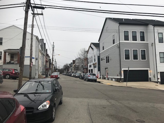 Picture shows integral garages at corner of 52nd and Keystone Streets in Upper Lawrenceville